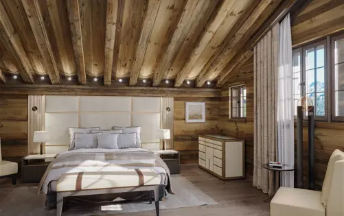 Luxury chalet bedroom with wooden walls, exposed beams, soft neutral decor, and large windows with mountain views.