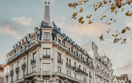 Elegant European architecture bathed in soft evening light, featuring refined stone façades and wrought-iron balconies — a timeless expression of sophistication and urban charm.