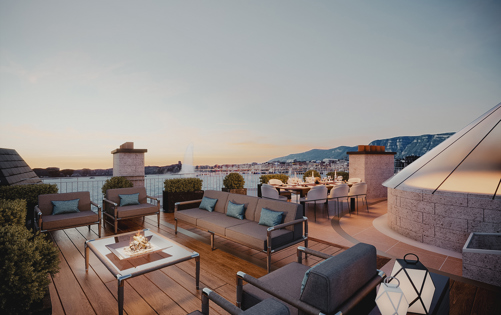 Elegant rooftop terrace offering refined outdoor living with panoramic views and warm sunset ambiance.